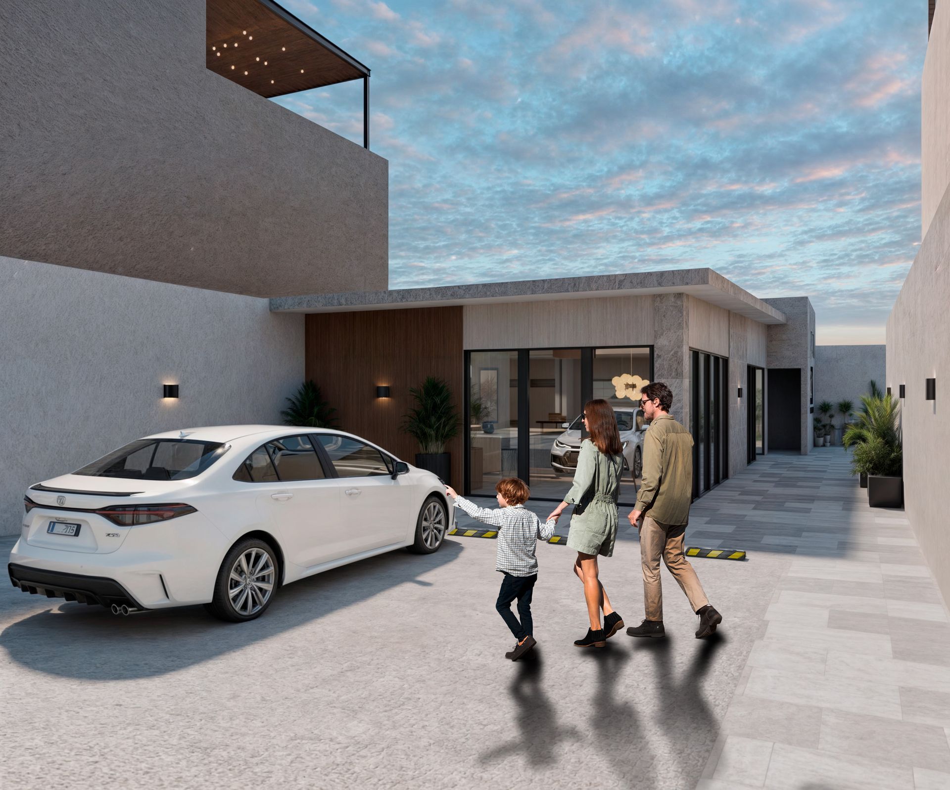 Familia caminando hacia una casa moderna con el auto estacionado en la entrada para casas en Tijuana
