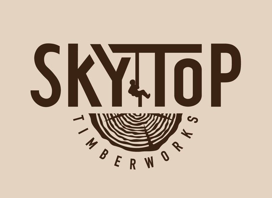 Sky Top Timberworks logo: Brown text over a beige background. Shows tree rings, a tree worker, and the name.