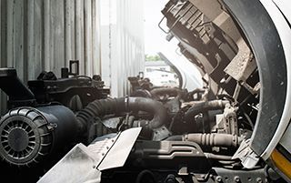 The engine of a truck is shown with the hood open.