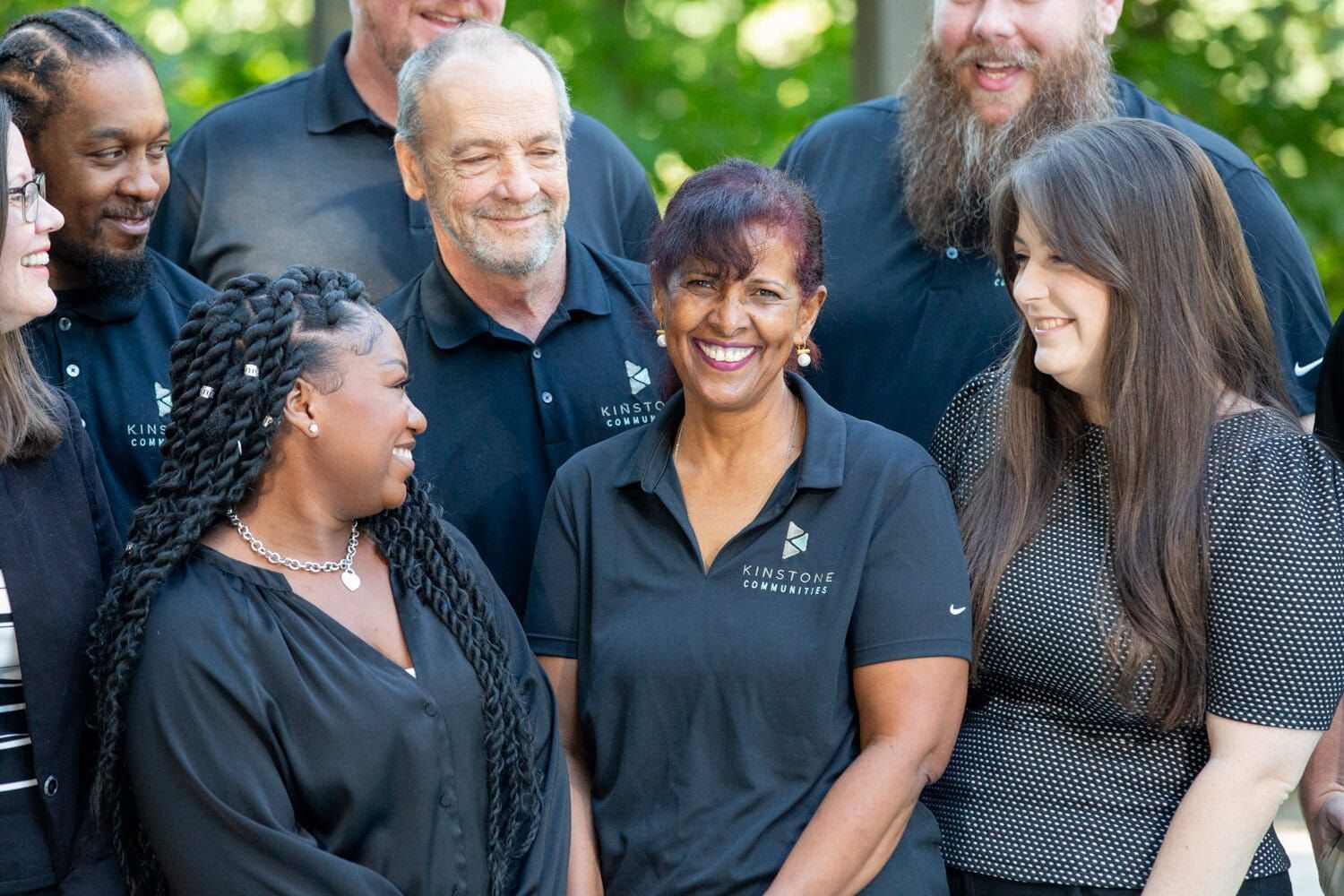 A group of people are posing for a picture together.