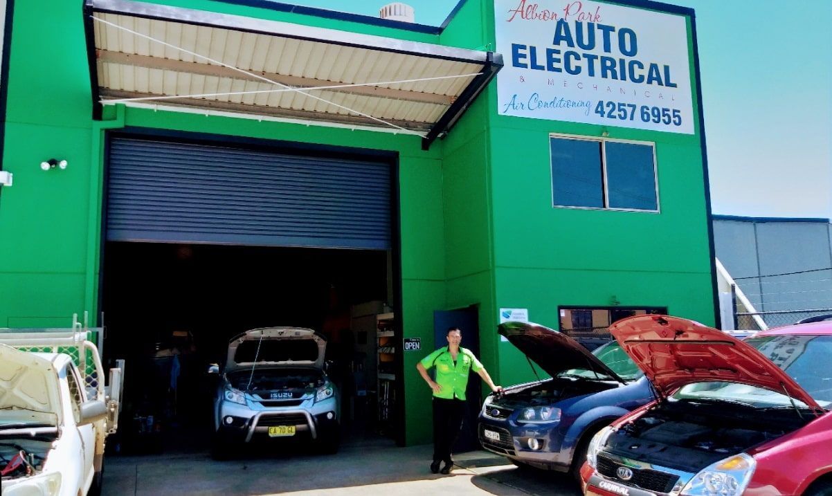 A Red Car Is Parked In Front Of A Building That Says Auto Electrical β Albion Park Auto Electrical & Mechanical In Albion Park Rail, NSW