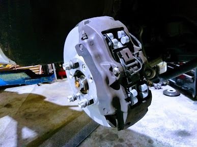 A Close Up Of A Brake Caliper On A Car β Albion Park Auto Electrical & Mechanical In Albion Park Rail, NSW