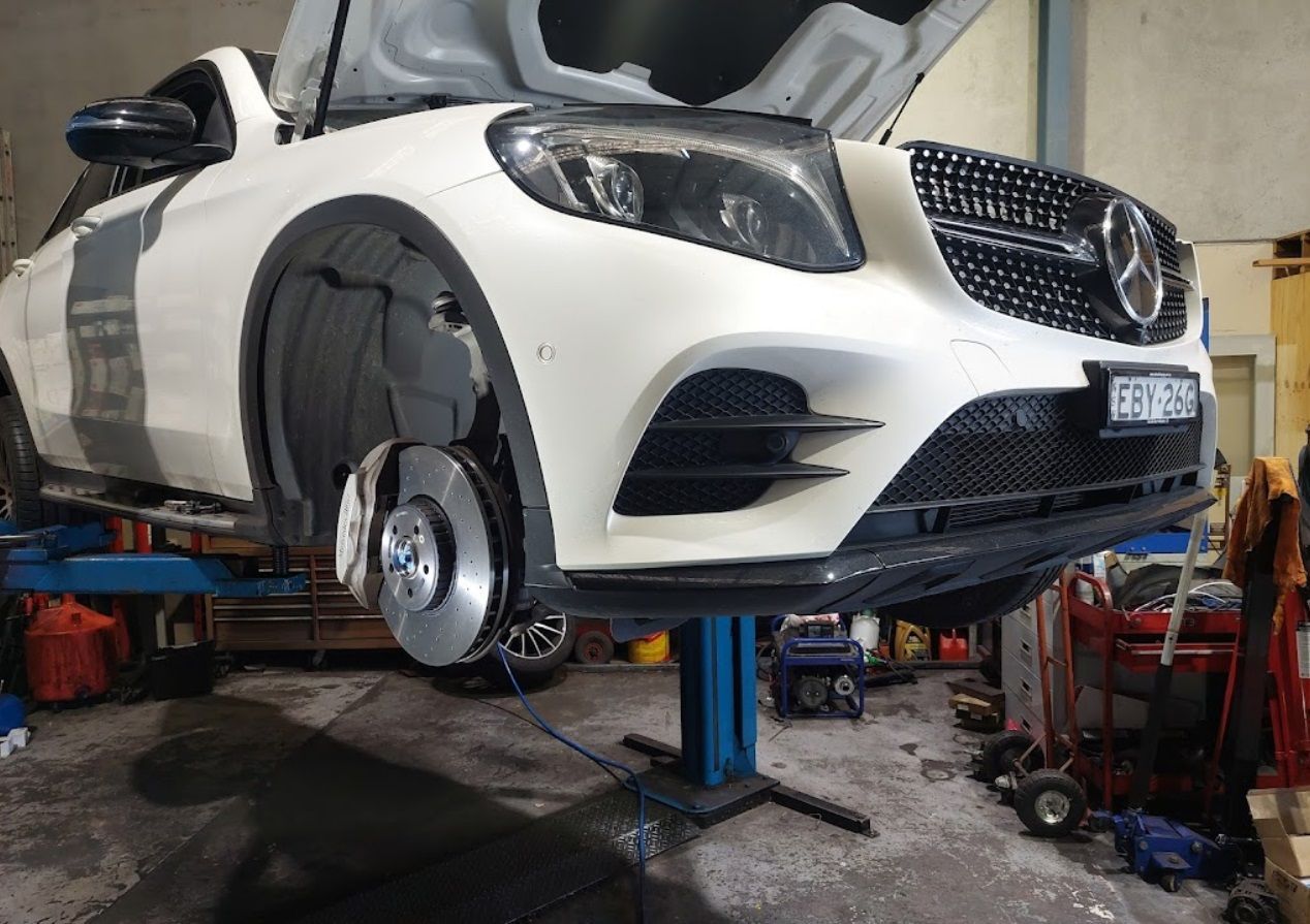 A Black Jeep Is Parked In Front Of A Building That Says Auto Electrical β Albion Park Auto Electrical & Mechanical In Albion Park Rail, NSW