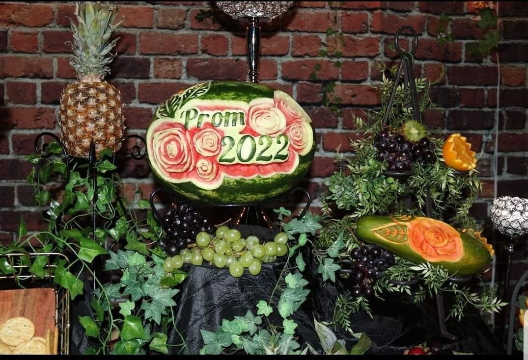 A watermelon with the year 2022 carved into it