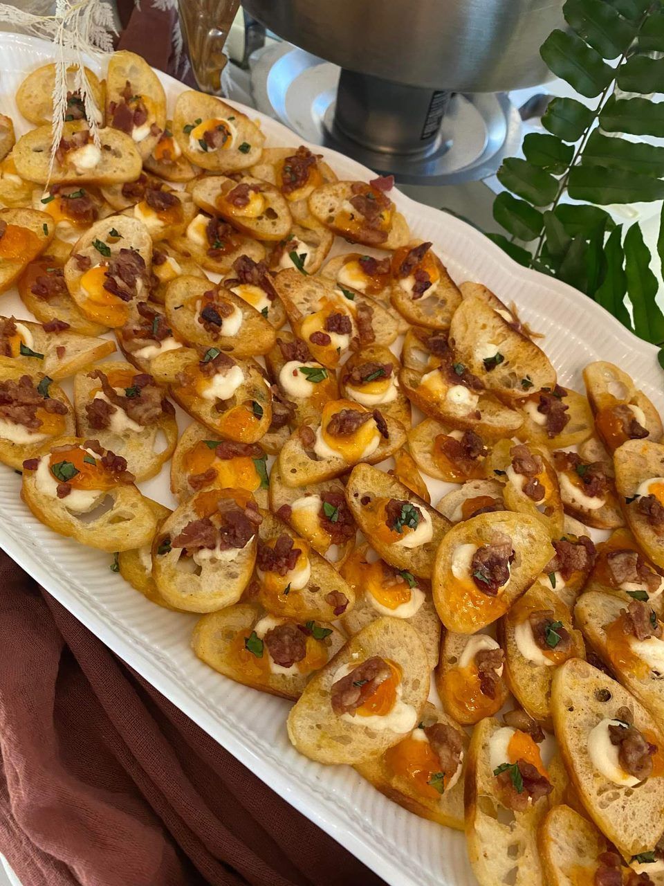 A white plate topped with a variety of appetizers.