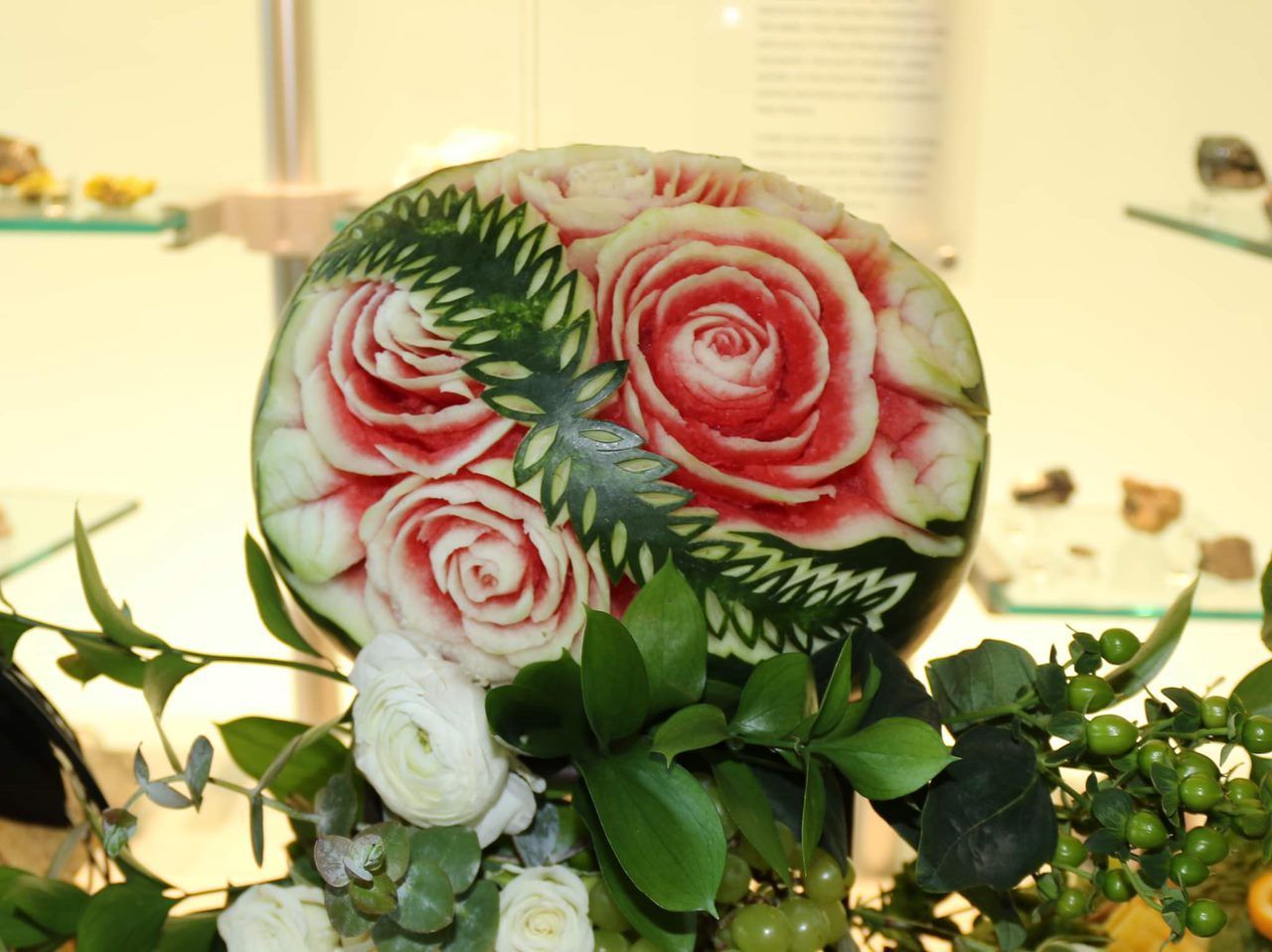 A watermelon with roses carved into it
