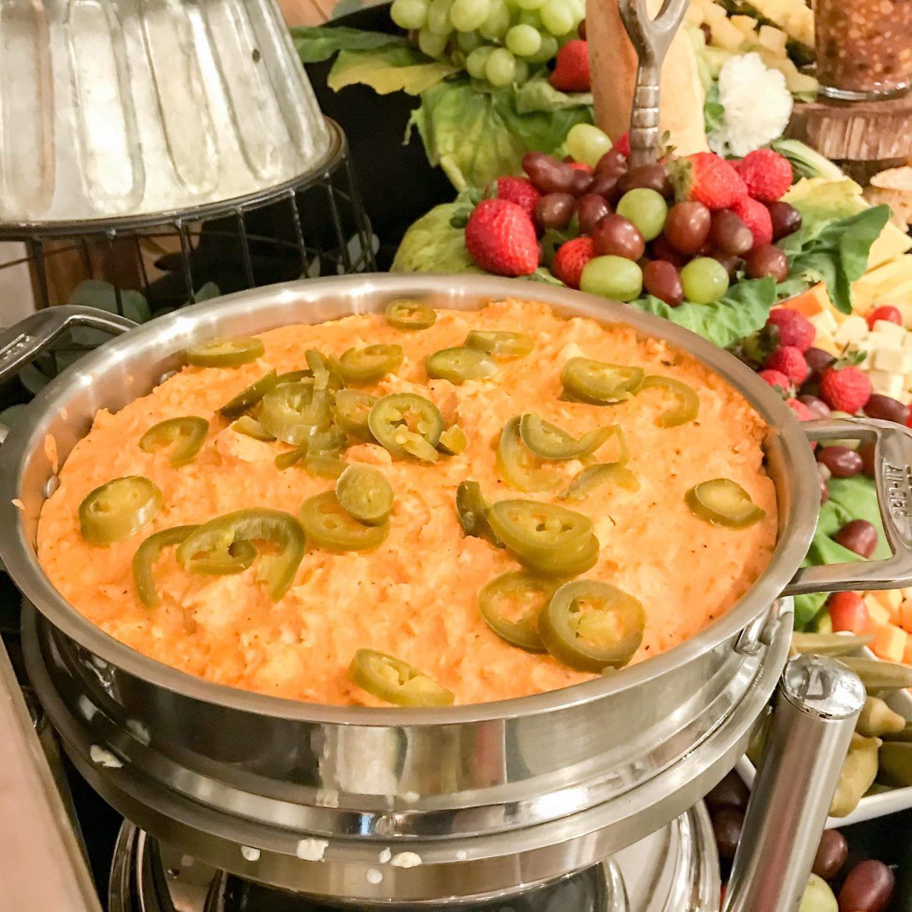 A pan of food with jalapenos on top of it