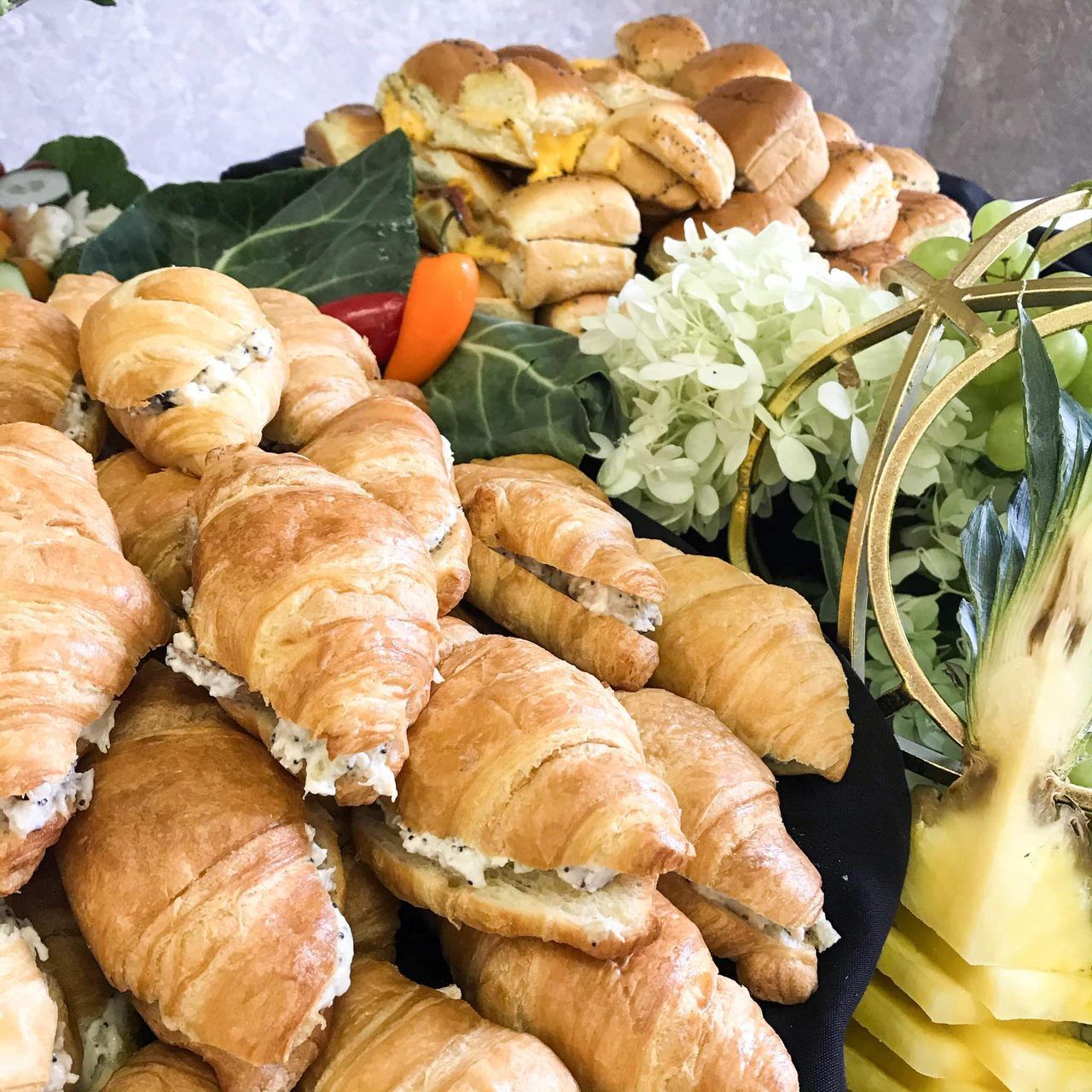 A bunch of croissants and vegetables on a plate