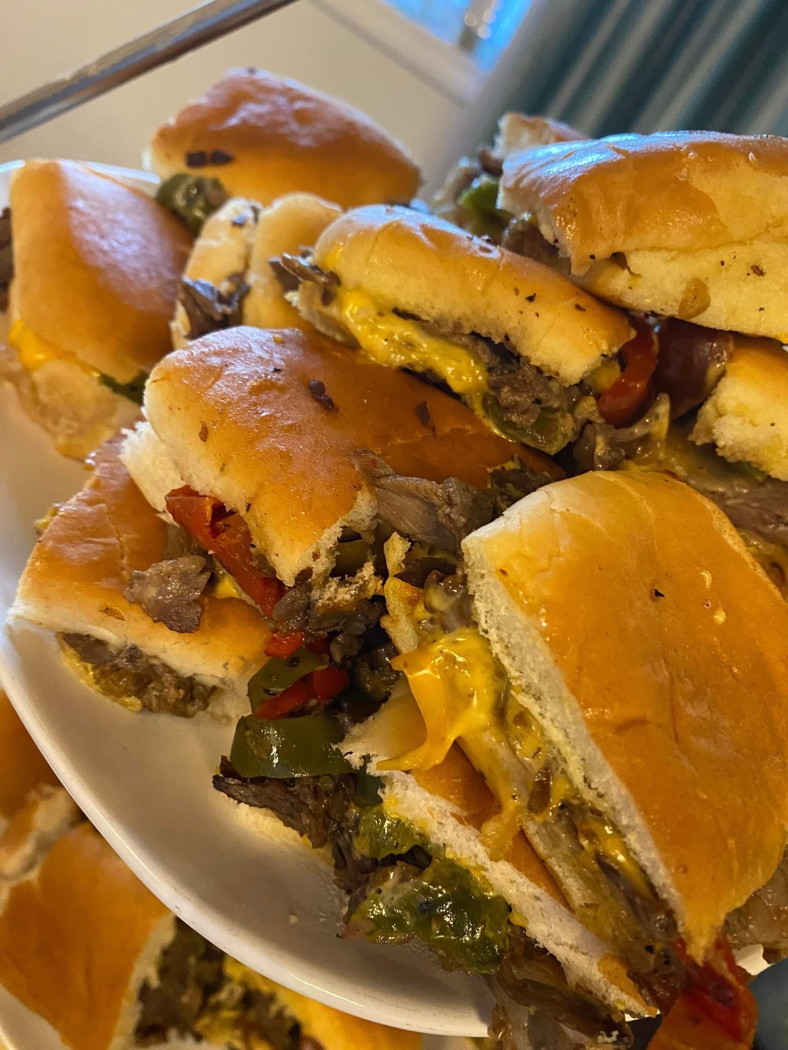A close up of a plate of sandwiches on a table.