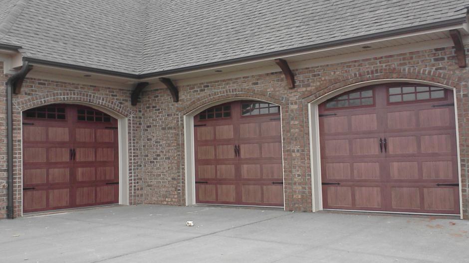 three car wooden-style garage doors
