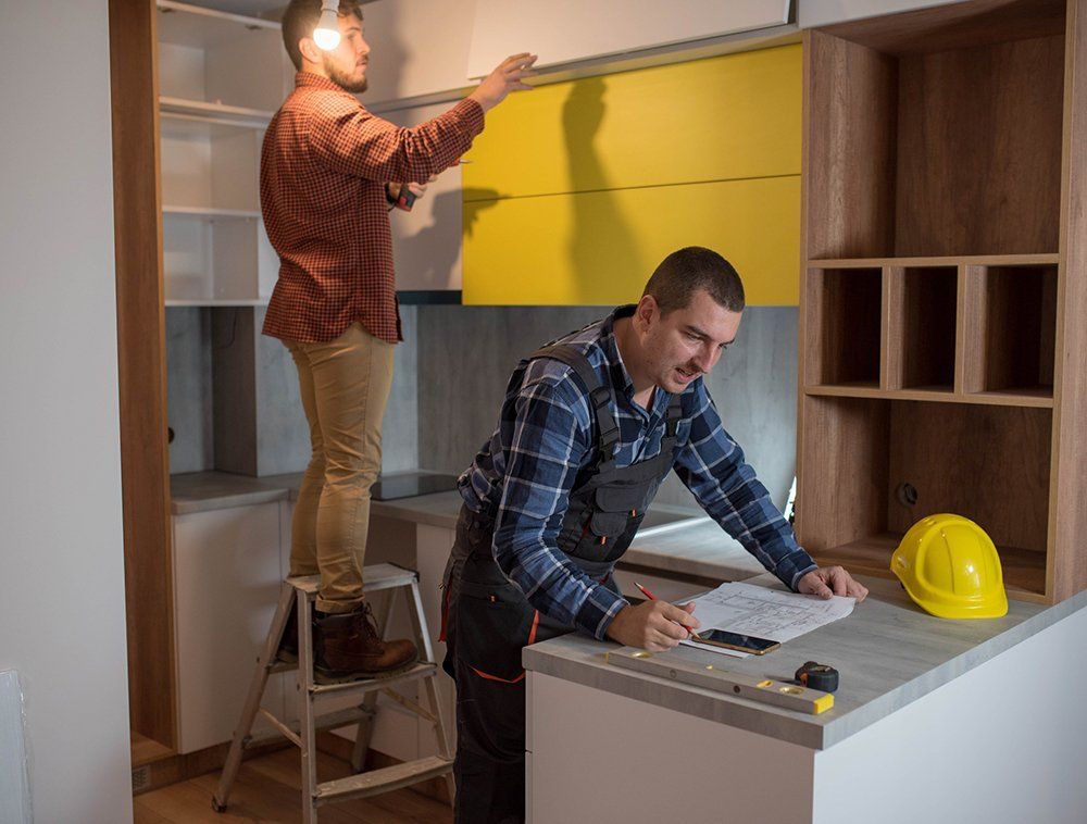 Two Men Remodeling A Kitchen — Shreveport, LA — AJE Building and Remodeling