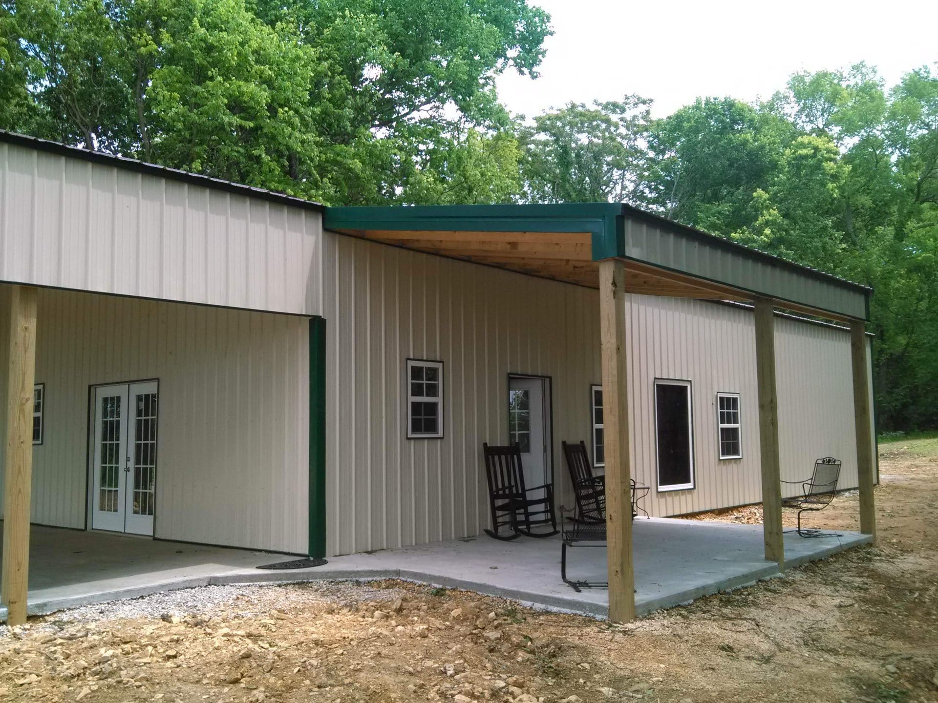 A house with a porch and rocking chairs on it