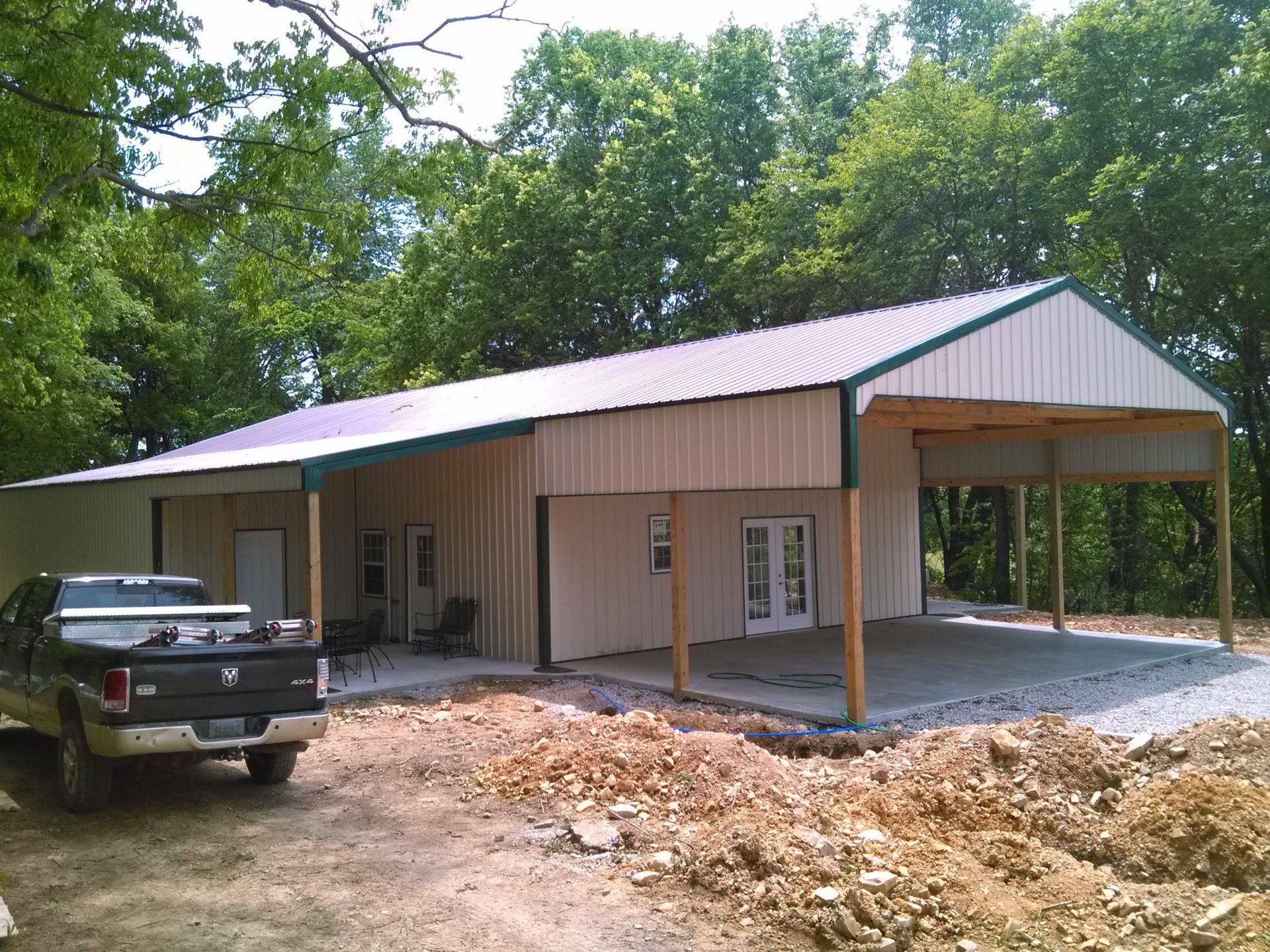 A truck is parked in front of a building under construction