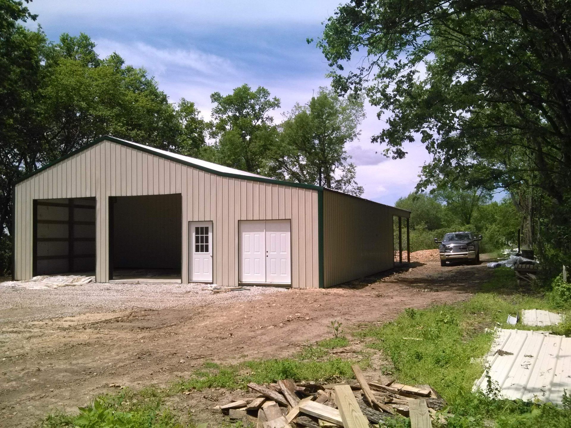 A garage with a car parked in front of it