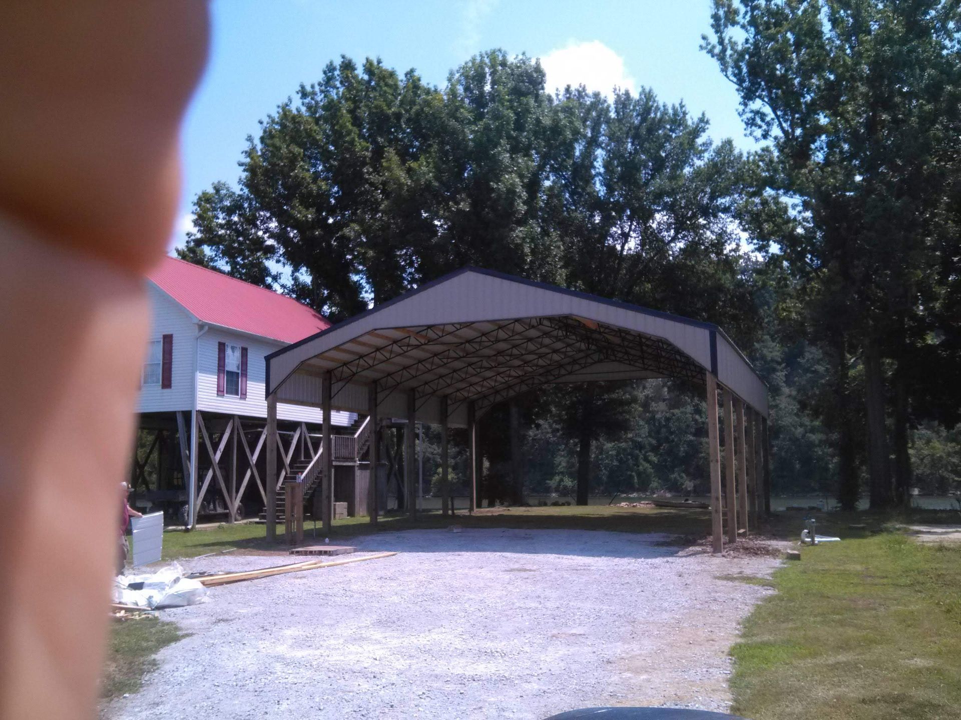 A building under construction with a red roof