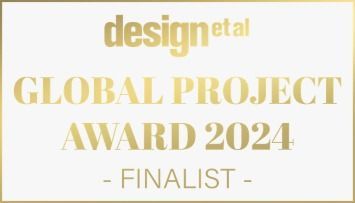 A gold badge that says design et al global project award 2024 finalist awarded to ya interiors