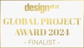 A gold badge that says design et al global project award 2024 finalist awarded to ya interiors