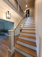 A staircase leading up to a second floor in a house.