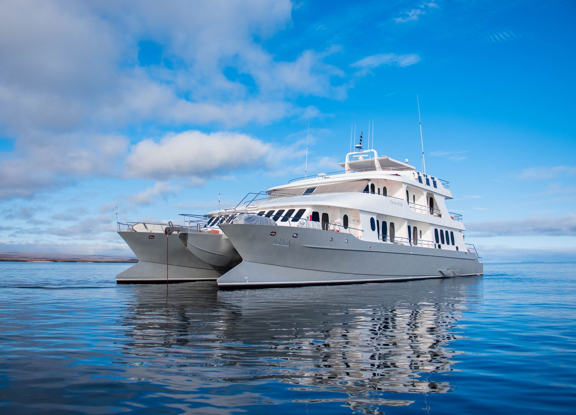 tour boat on the ocean, people jumping off