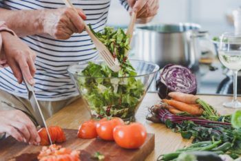 person making a salad at home