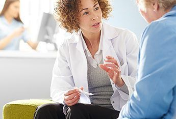 nurse and patient talking