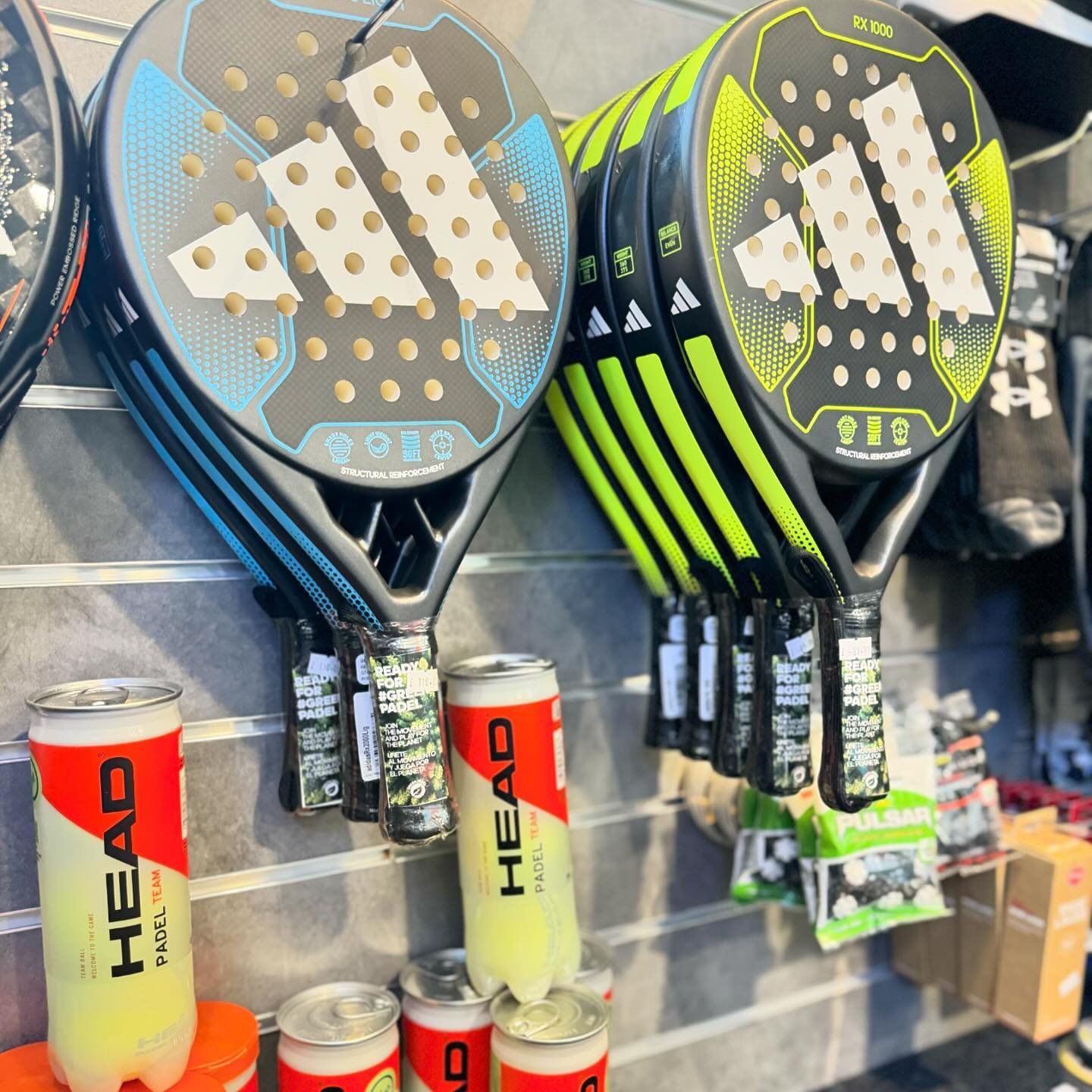 A display of tennis rackets and head tennis balls