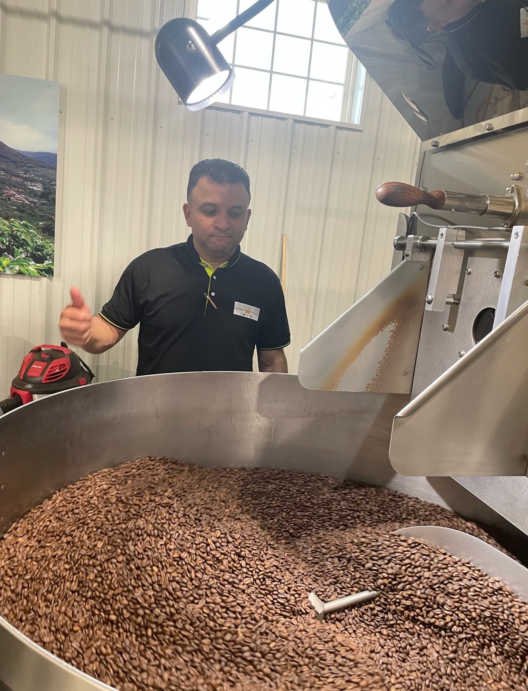 Man Making Ground Coffee — Woodbridge, VA — Happy Place Coffee & Eats