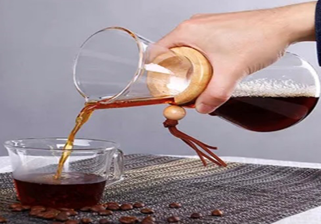 Hand Pouring Dark Coffee — Woodbridge, VA — Happy Place Coffee & Eats