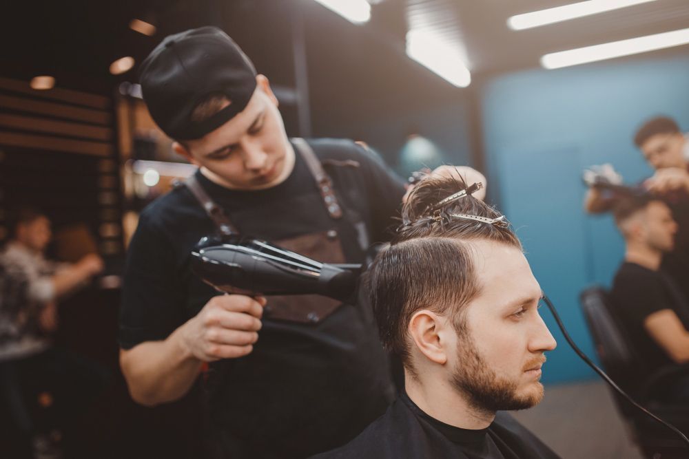 Barber Using Hairdryer — Mobile Scissor Sharpening in Ilkley, QLD