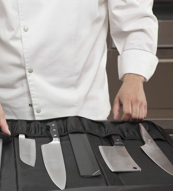 Man Sharpening the Knife With a Electric Sharpener — Mobile Scissor Sharpening in Sunshine Coast, QLD