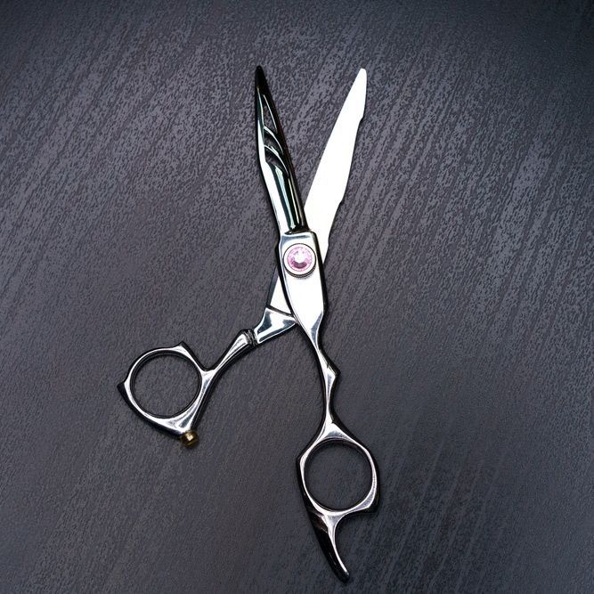 Sharpening Stone With a Knife and Scissors — Mobile Scissor Sharpening in Sunshine Coast, QLD