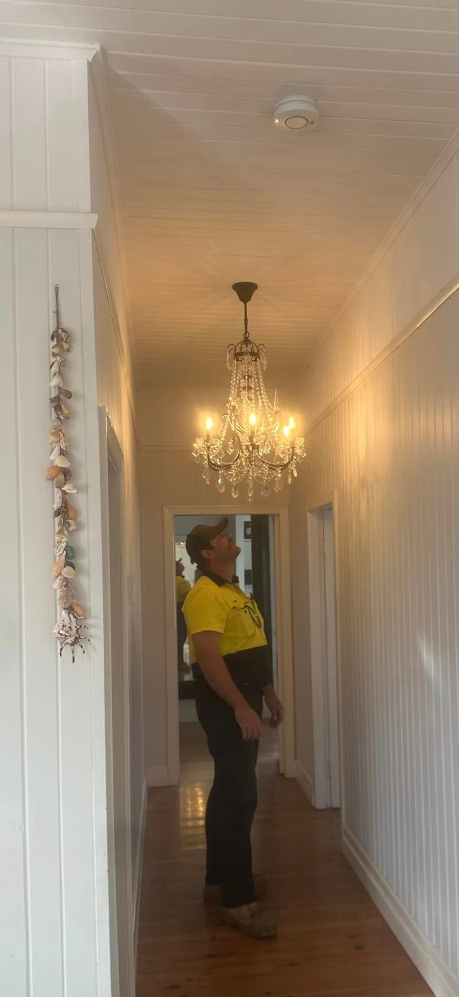 Man Looking At The Ceiling — Kawungan, QLD — Electricians@Work