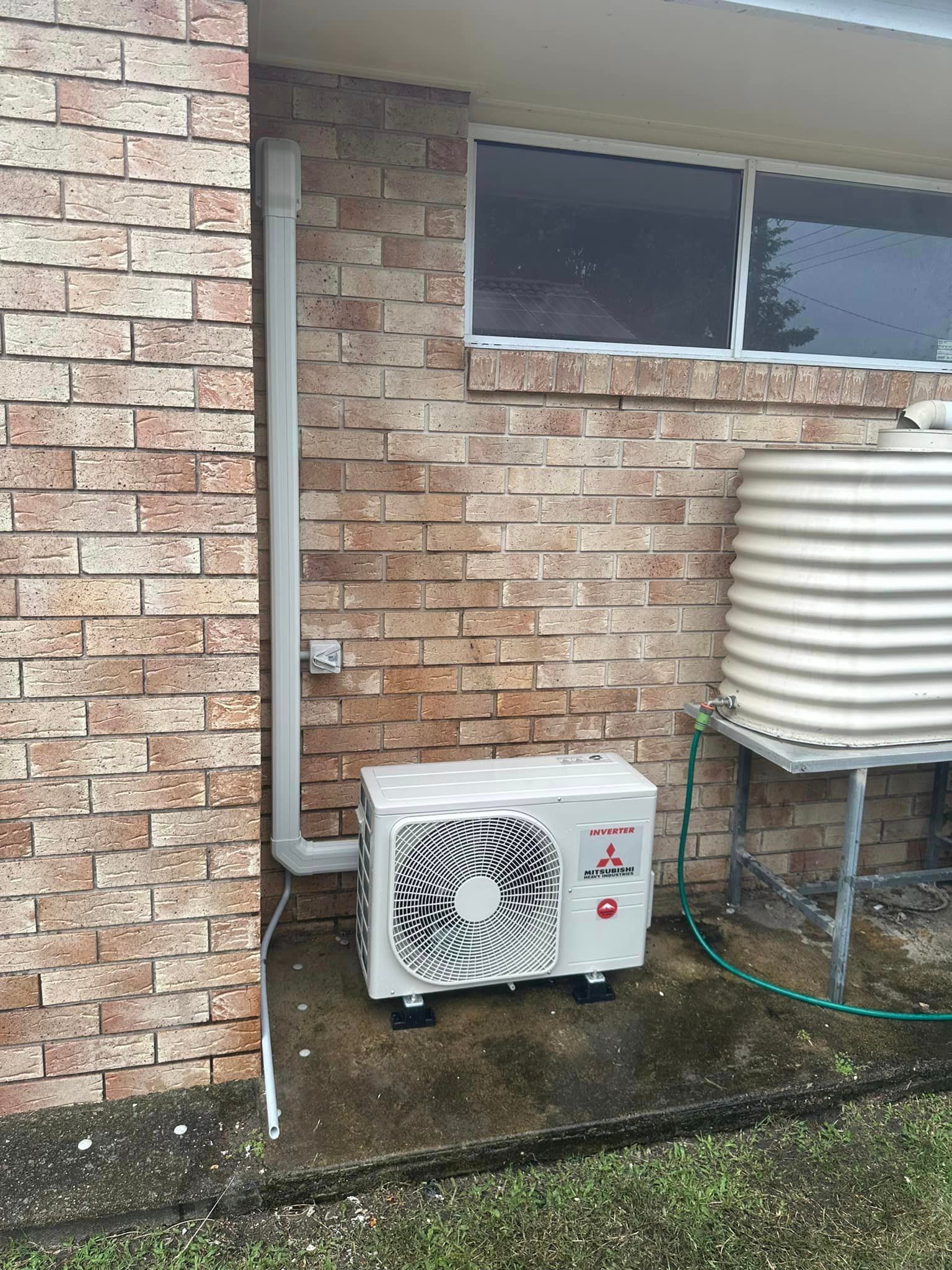 Inverter On Side Of The Water Tank — Kawungan, QLD — Electricians@Work