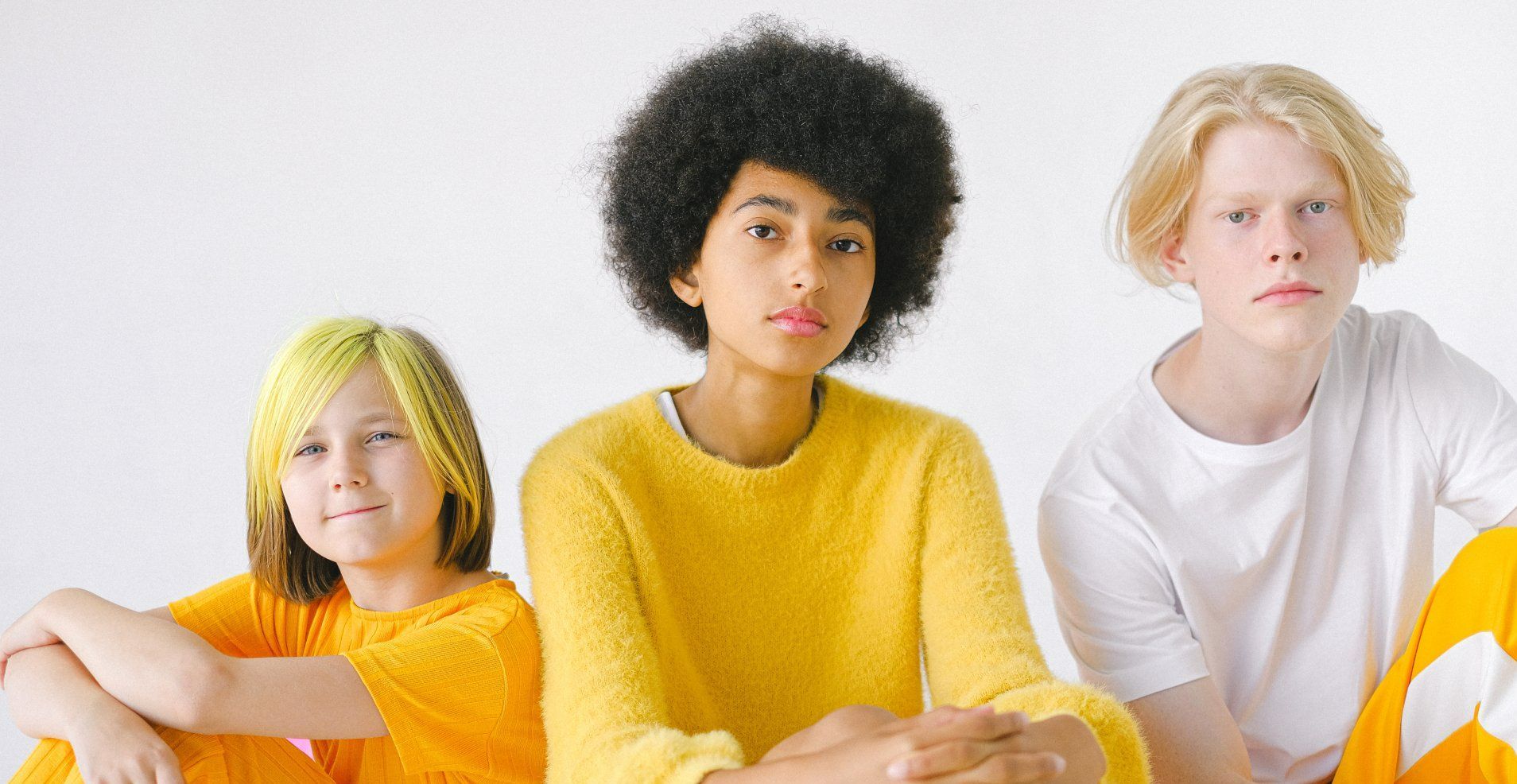 image of 3 teens in yellow and white