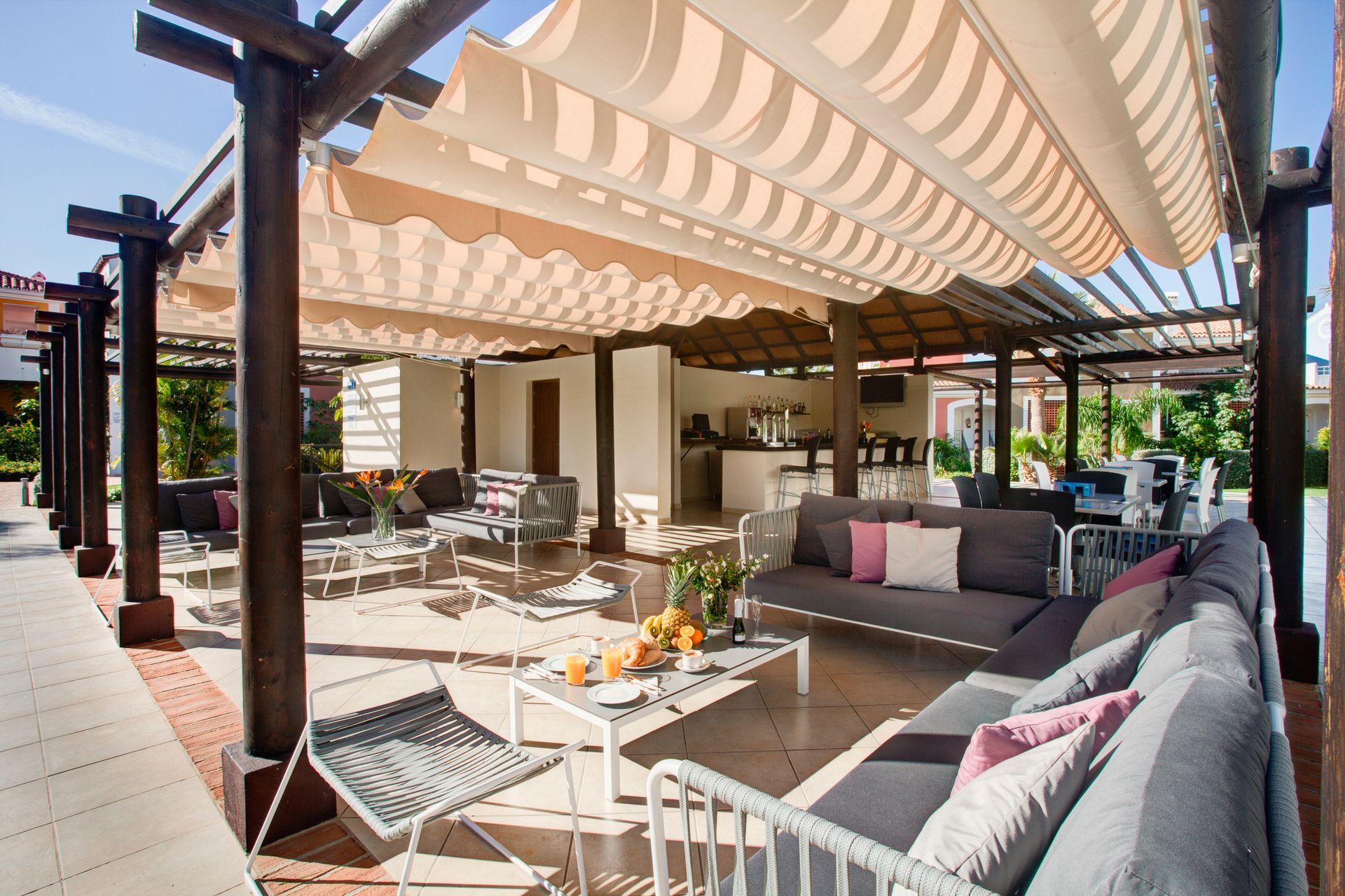 A white umbrella with a blue sky in the background
