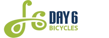 The logo for day 6 bicycles is green and blue.