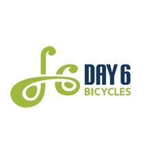 The logo for day 6 bicycles is green and blue