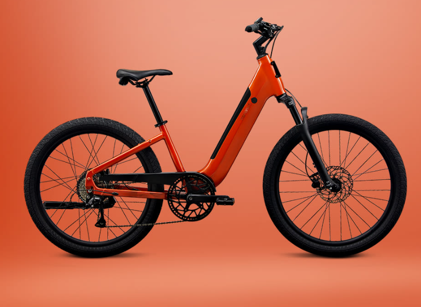 An orange electric step-through mountain bike with black tires and components, isolated against an orange background.