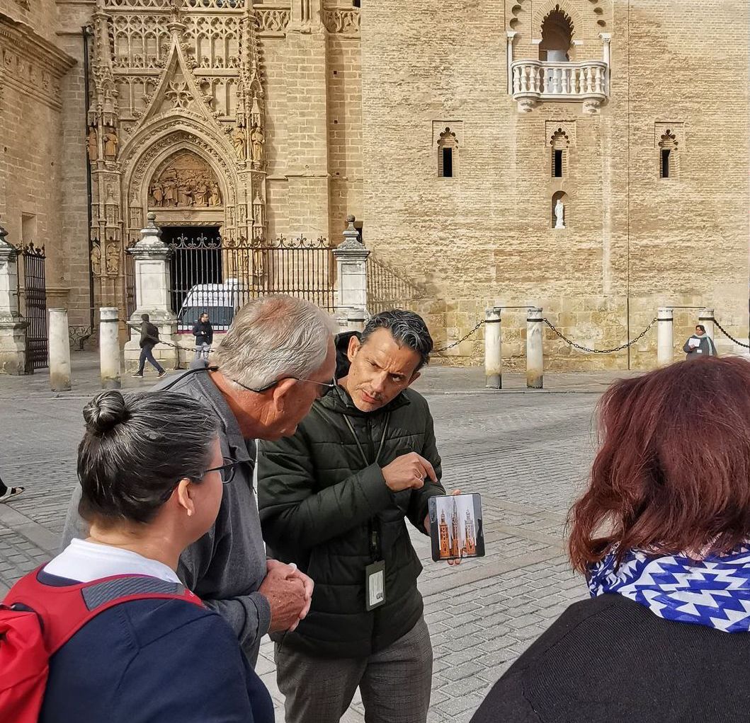 A group of people are standing in a line talking to each other