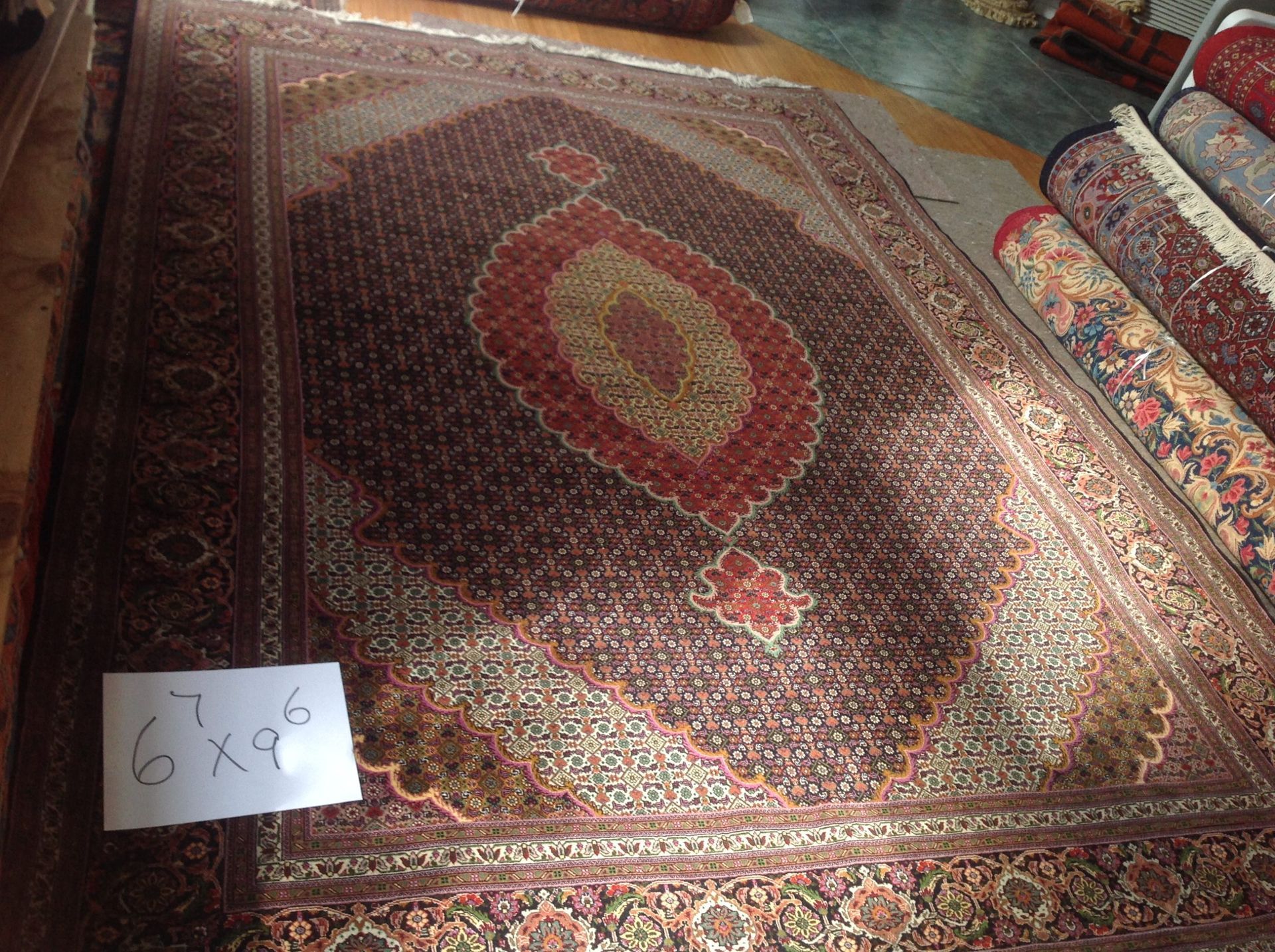 A rug with the number 6x9 on it
