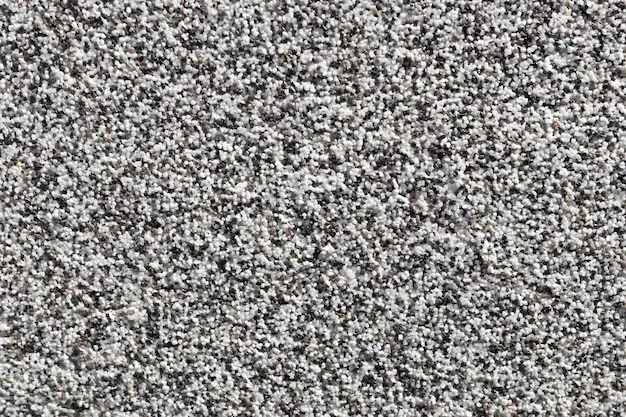 A close up of a gray and white carpet texture.