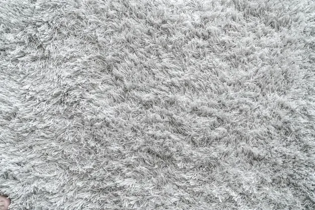 A close up of a gray carpet texture.