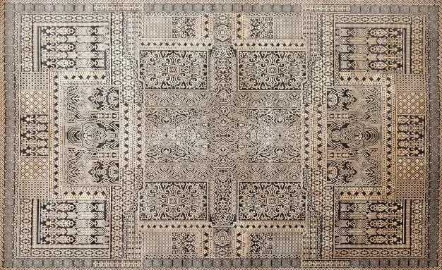 A rug with a pattern on it is sitting on a table.
