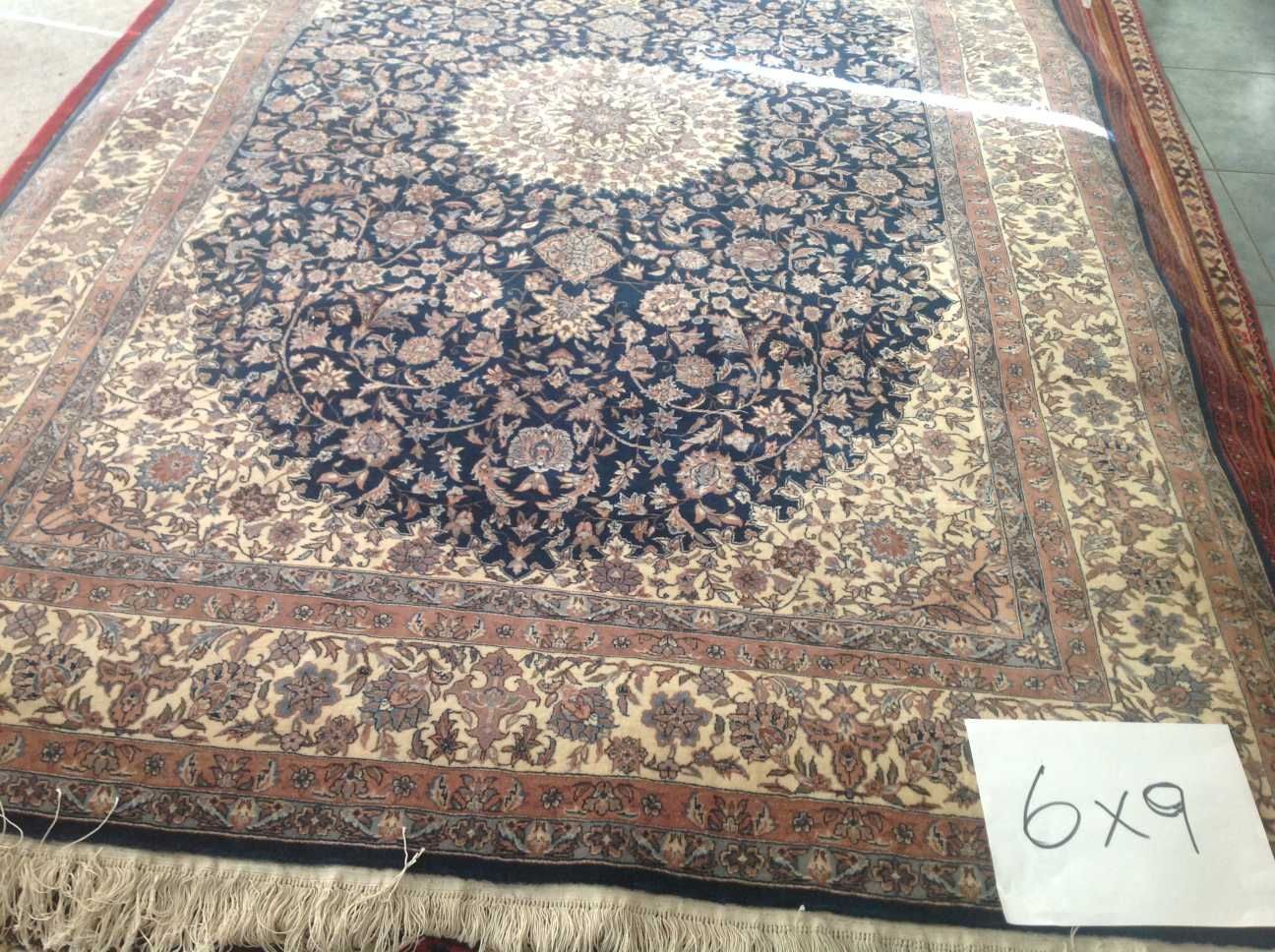 A rug with the number 6x9 on it