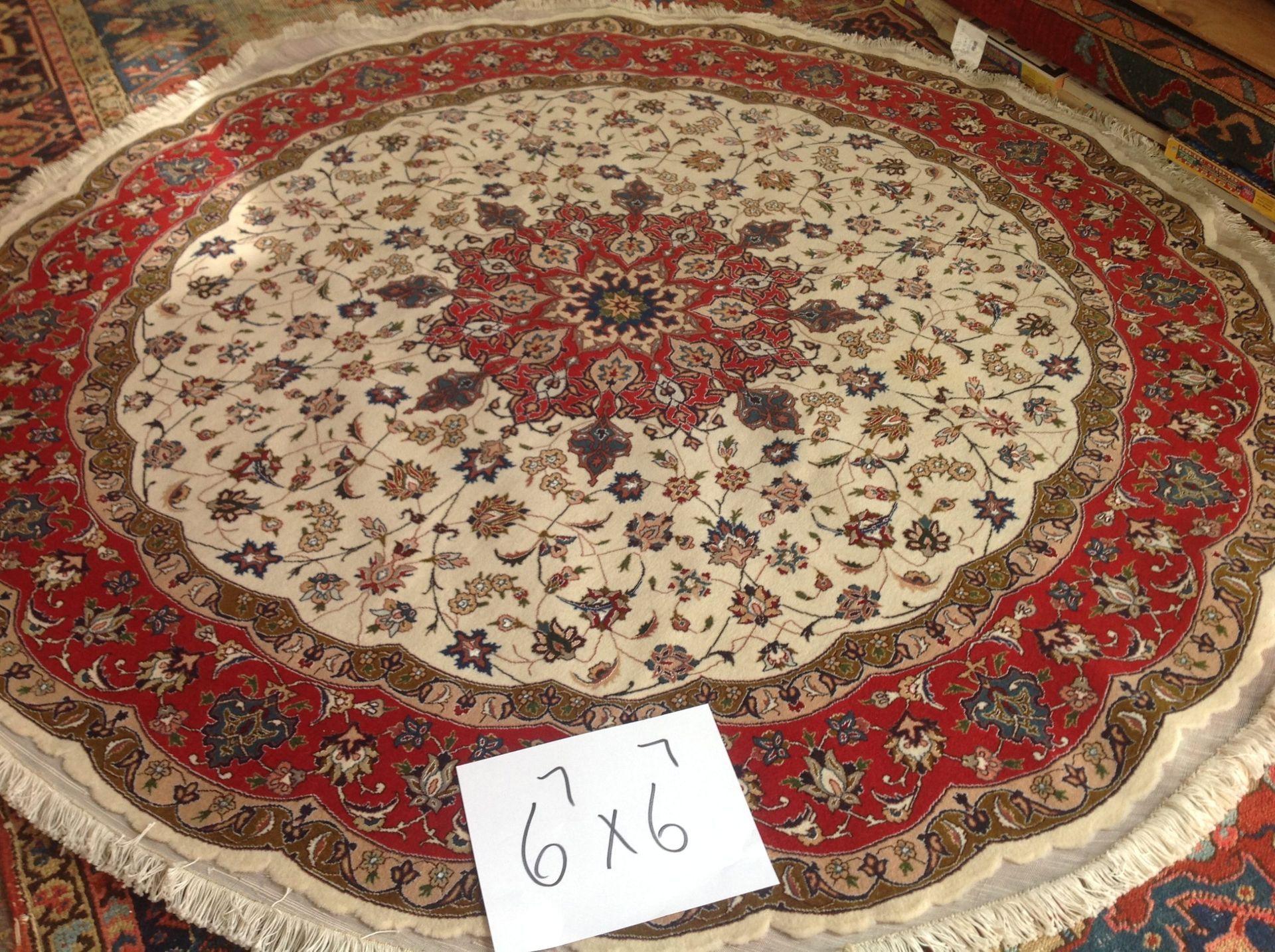 A round rug with the number 6x6 on it