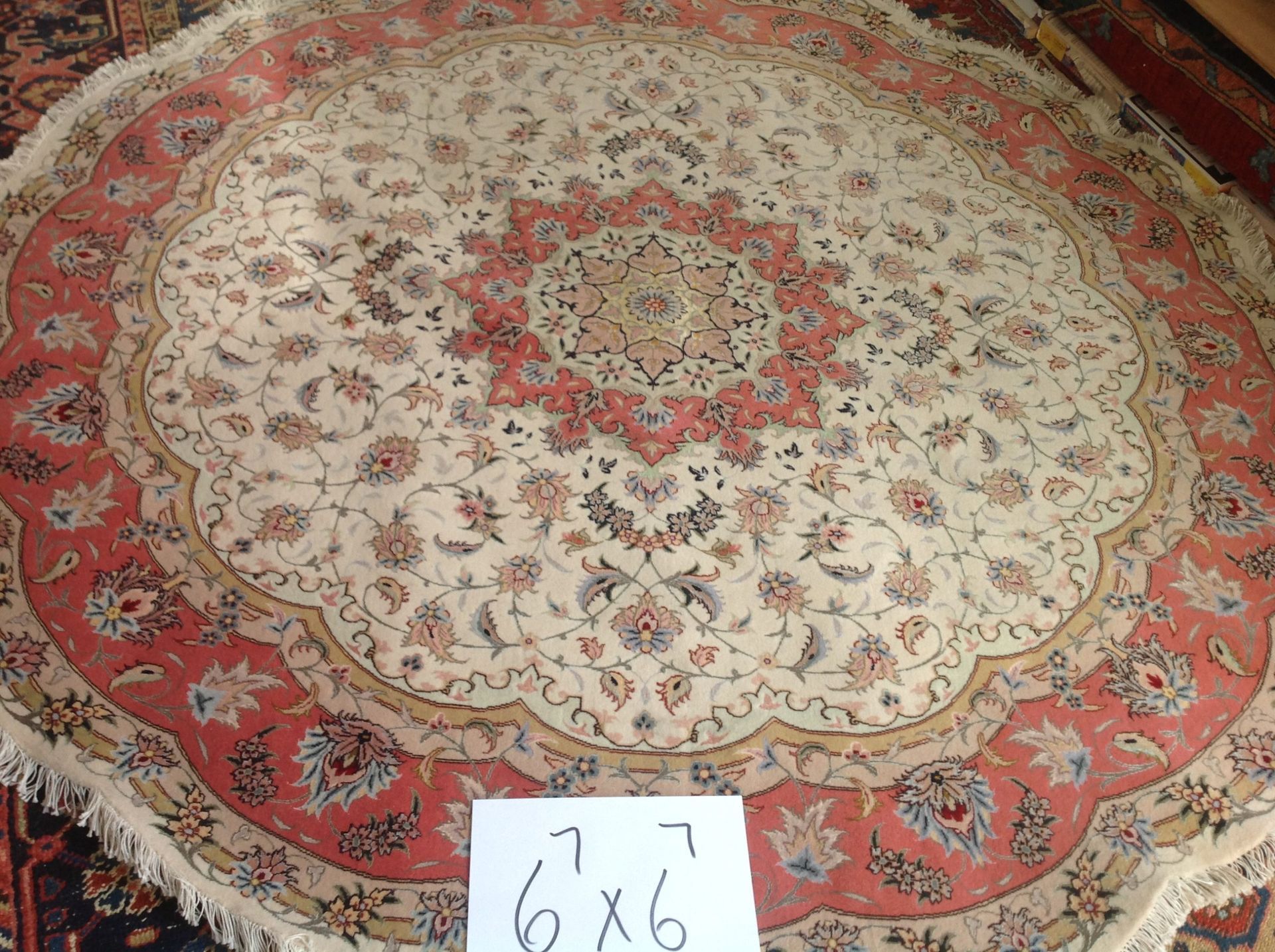 A round rug with the number 6x6 on it
