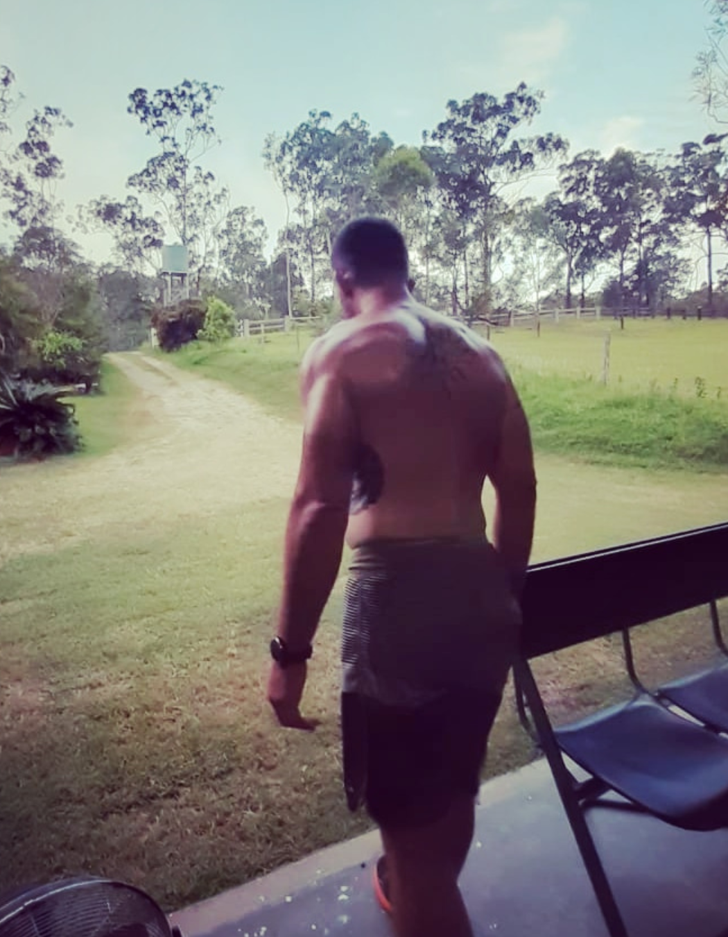The Warrior's Way founder Brandt Cogill steps out of his house and into his yard.