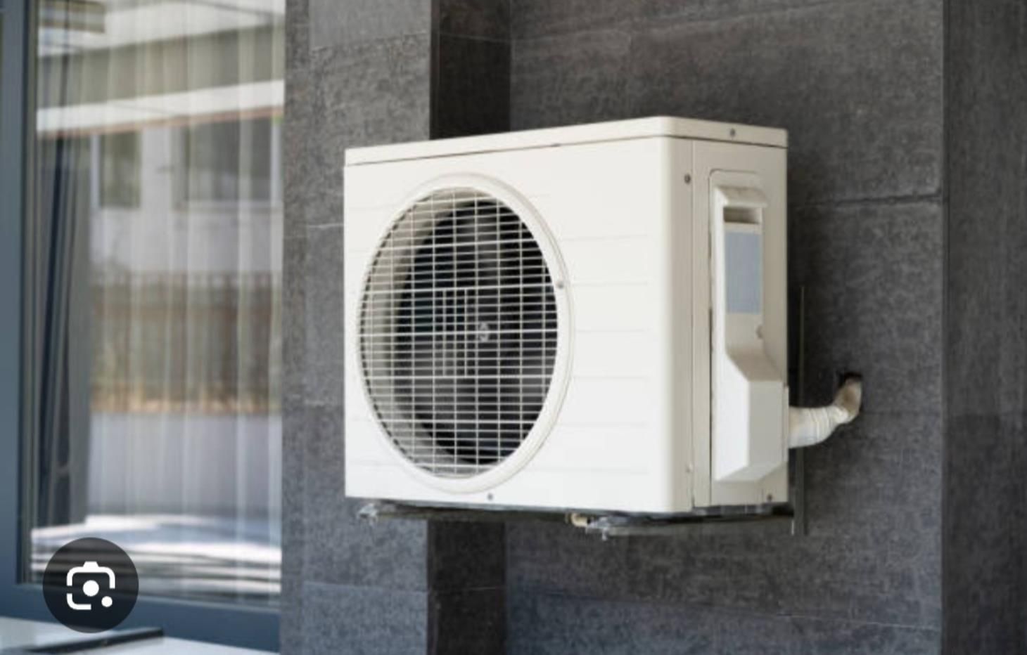 Diligent HVAC technician inspecting a residential AC unit for optimal performance and efficiency.