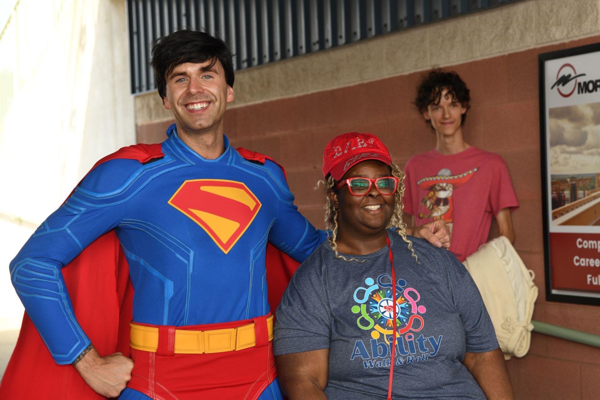 a group of people are posing for a picture with santa claus .