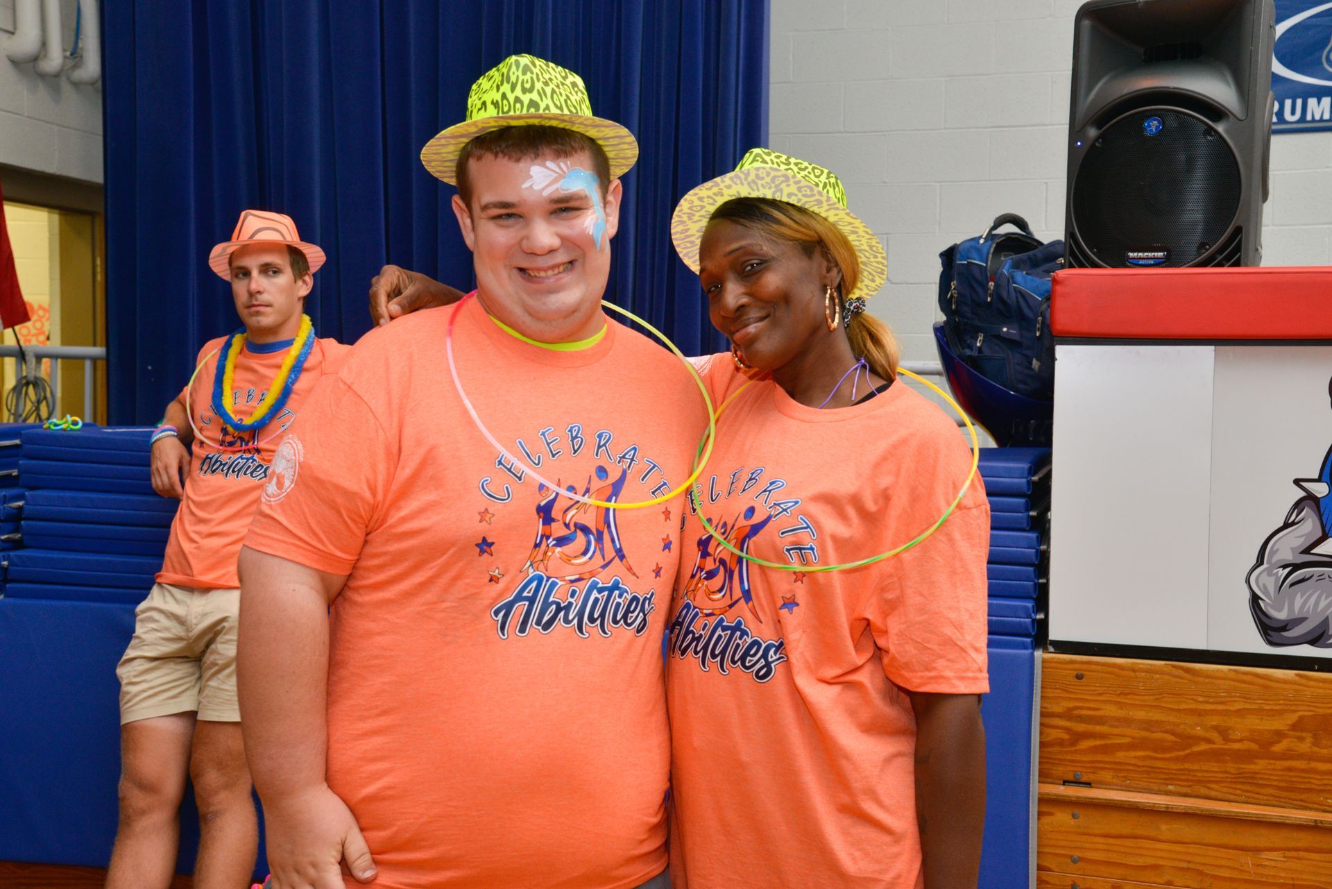 a group of people are dancing in a gym 